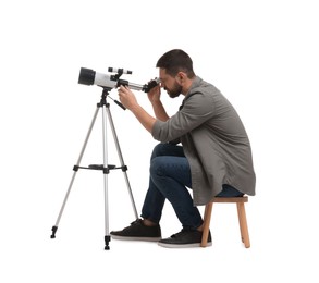 Photo of Astronomer looking at stars through telescope on white background