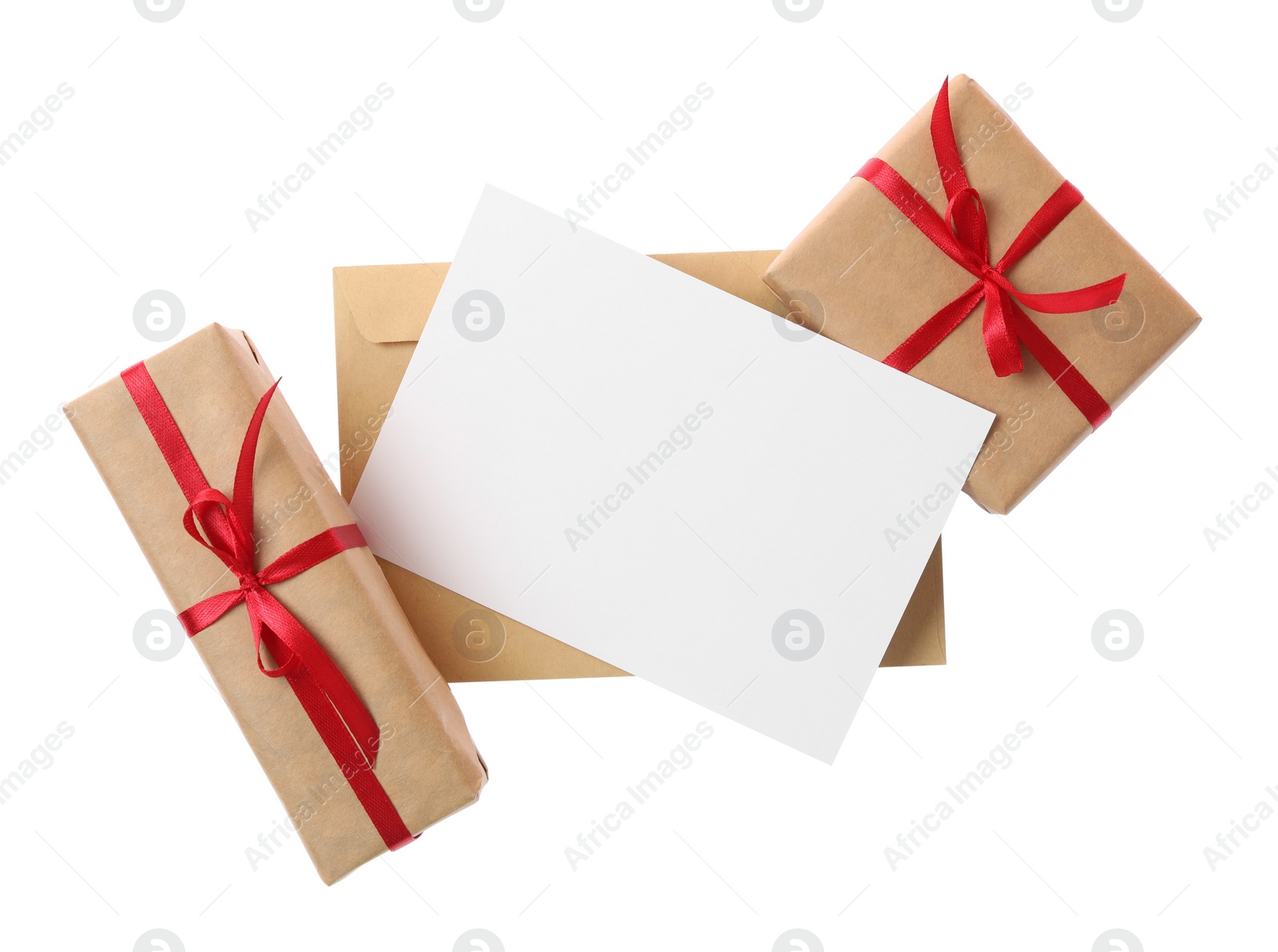 Photo of Blank card, envelope and gift boxes on white background, top view. Valentine's Day celebration