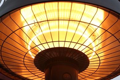 Closeup view of hanging electric infrared heater