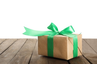 Christmas gift on wooden table against white background