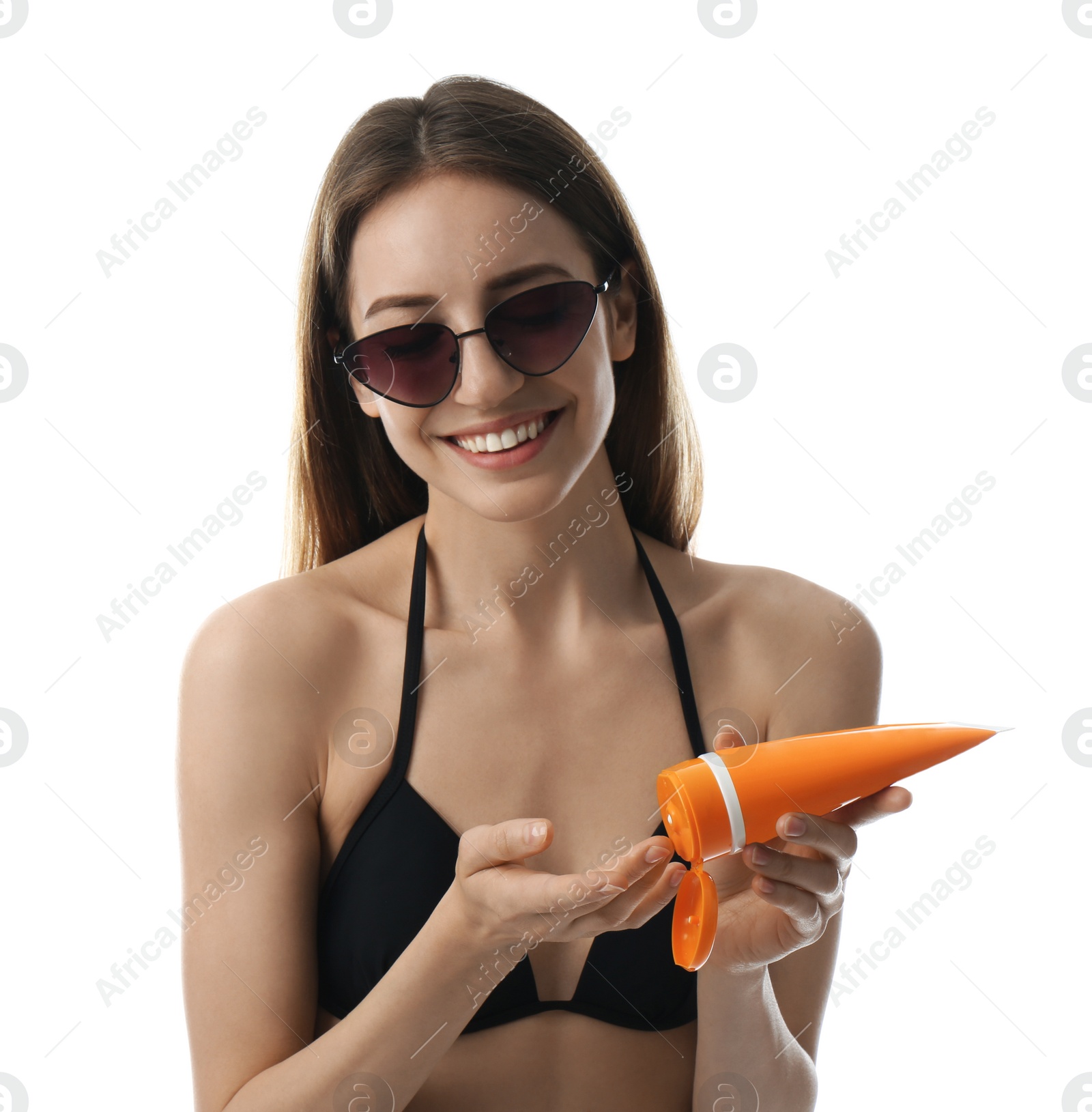 Photo of Young woman applying sun protection cream on white background