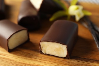 Photo of Glazed curd cheese bars on table, closeup