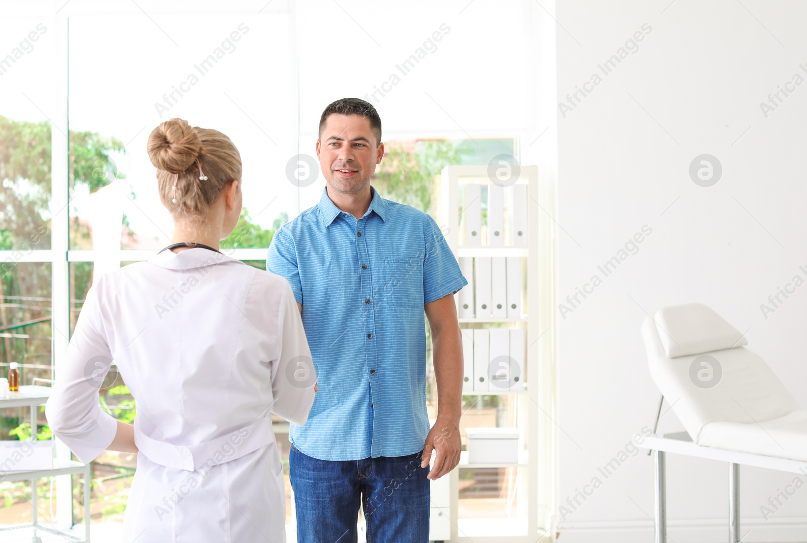 Photo of Patient having appointment with doctor in hospital