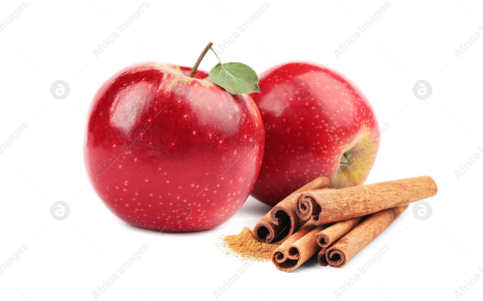 Image of Aromatic cinnamon sticks and red apples isolated on white