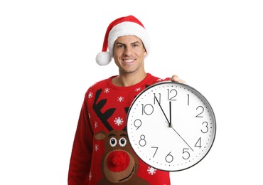 Man in Santa hat with clock on white background. New Year countdown
