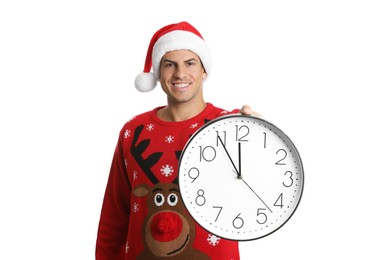 Photo of Man in Santa hat with clock on white background. New Year countdown