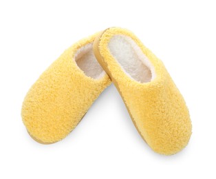 Photo of Pair of yellow soft slippers isolated on white, top view