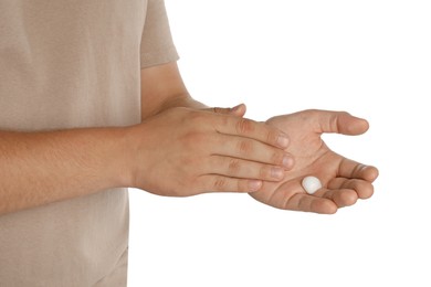 Photo of Man applying cream on hands against white background, closeup