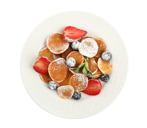Photo of Plate with cereal pancakes and berries isolated on white, top view
