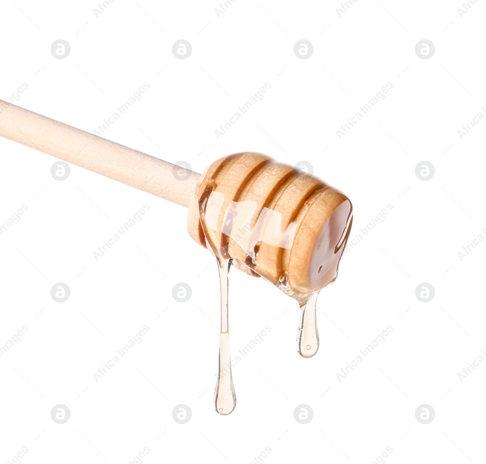 Photo of Natural honey dripping from dipper on white background