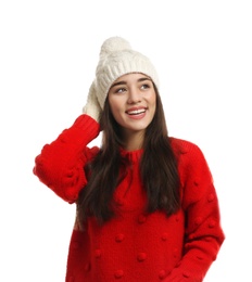 Young woman wearing warm clothes on white background. Winter season