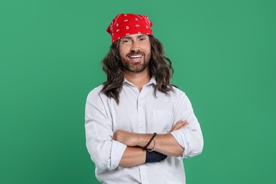 Photo of Stylish hippie man in white shirt on green background