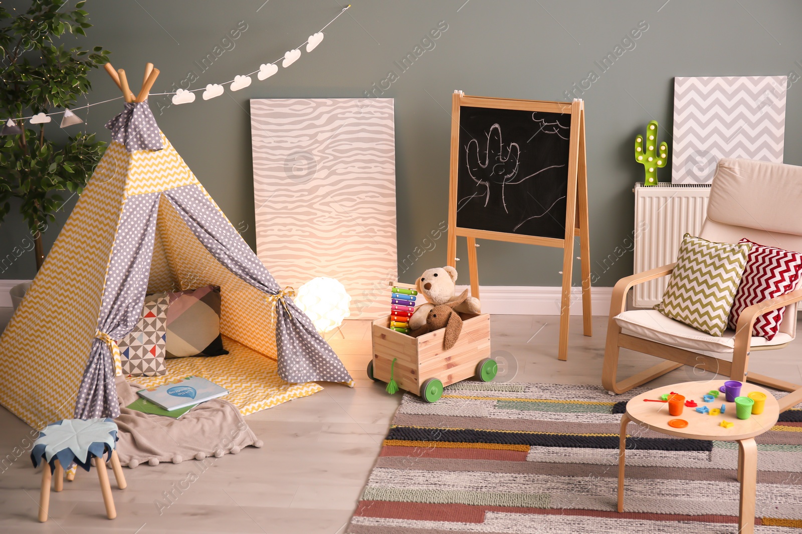 Photo of Modern room interior with play tent for child