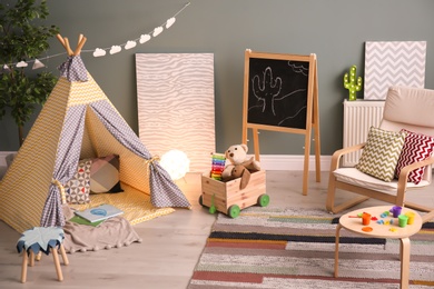 Modern room interior with play tent for child