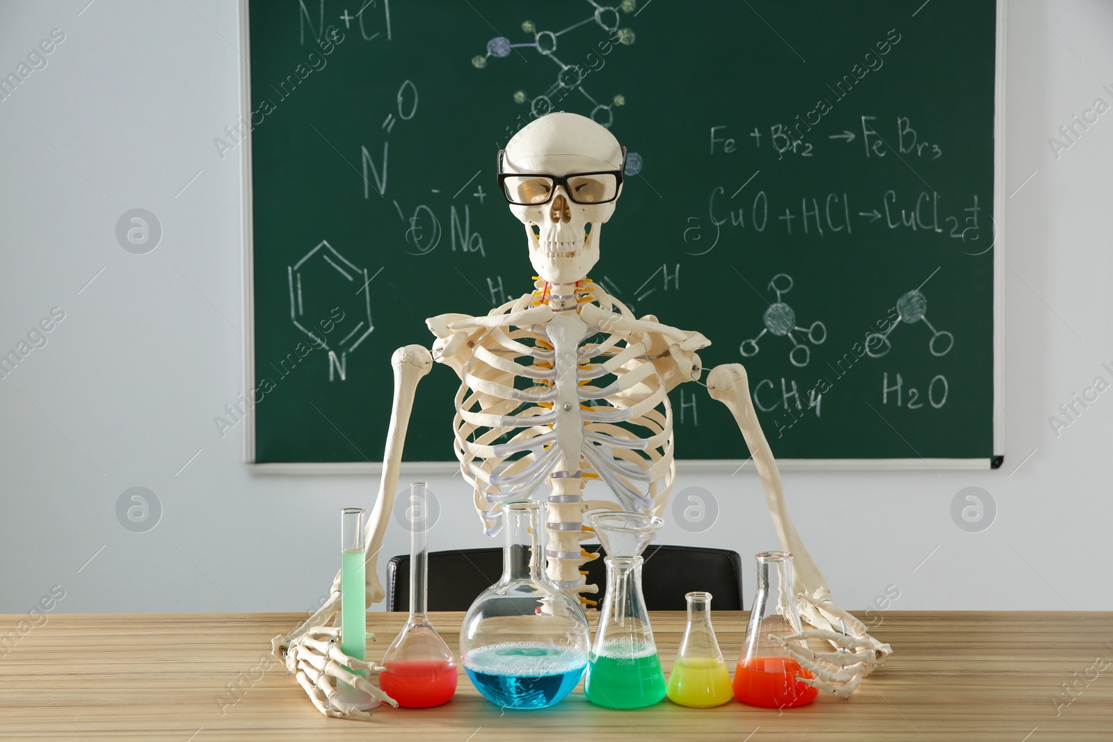 Photo of Skeleton and different chemistry glassware in classroom