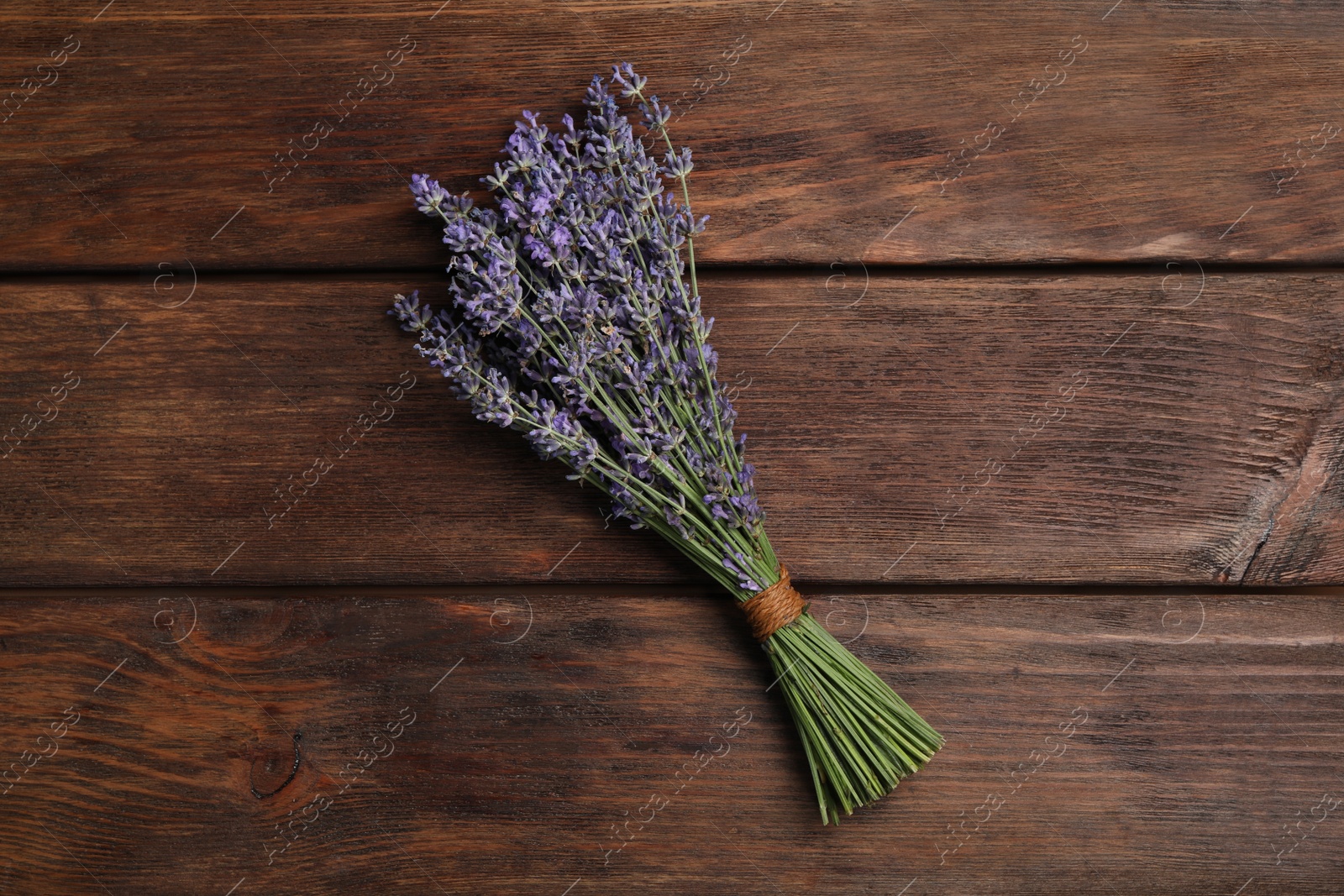 Photo of Beautiful lavender bouquet on wooden background, top view