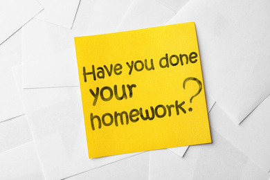Image of Note with phrase HAVE YOU DONE YOUR HOMEWORK? on paper sheets, top view 