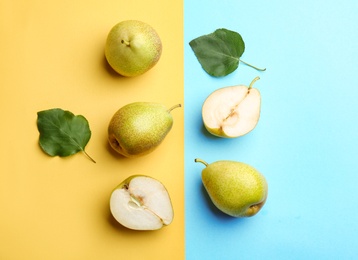 Ripe juicy pears on color background, flat lay