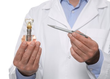 Photo of Dentist holding educational model of dental implant on white background, closeup