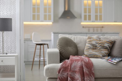 Photo of Modern apartment with comfortable sofa. Interior design