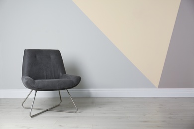 Photo of Grey modern chair for interior design on wooden floor at color wall