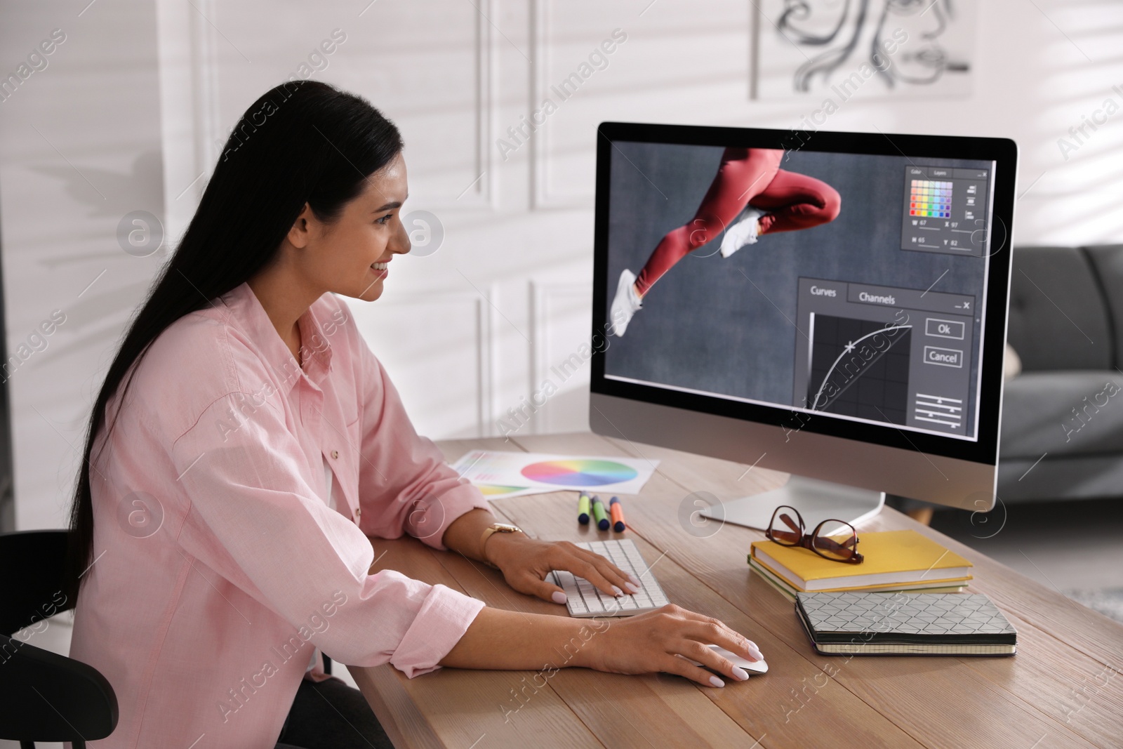 Photo of Professional retoucher working on computer in office