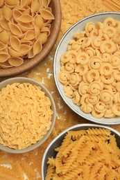 Photo of Different types of pasta on table, flat lay