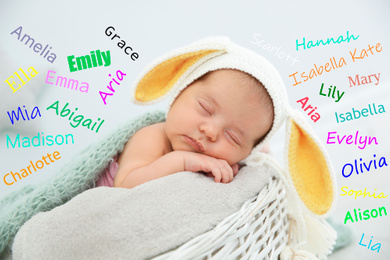 Choosing name for baby girl. Adorable newborn sleeping 