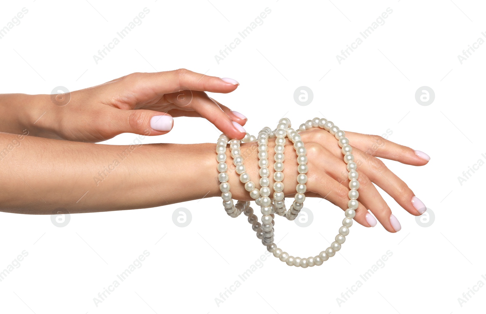 Photo of Young woman with elegant pearl necklace on white background, closeup