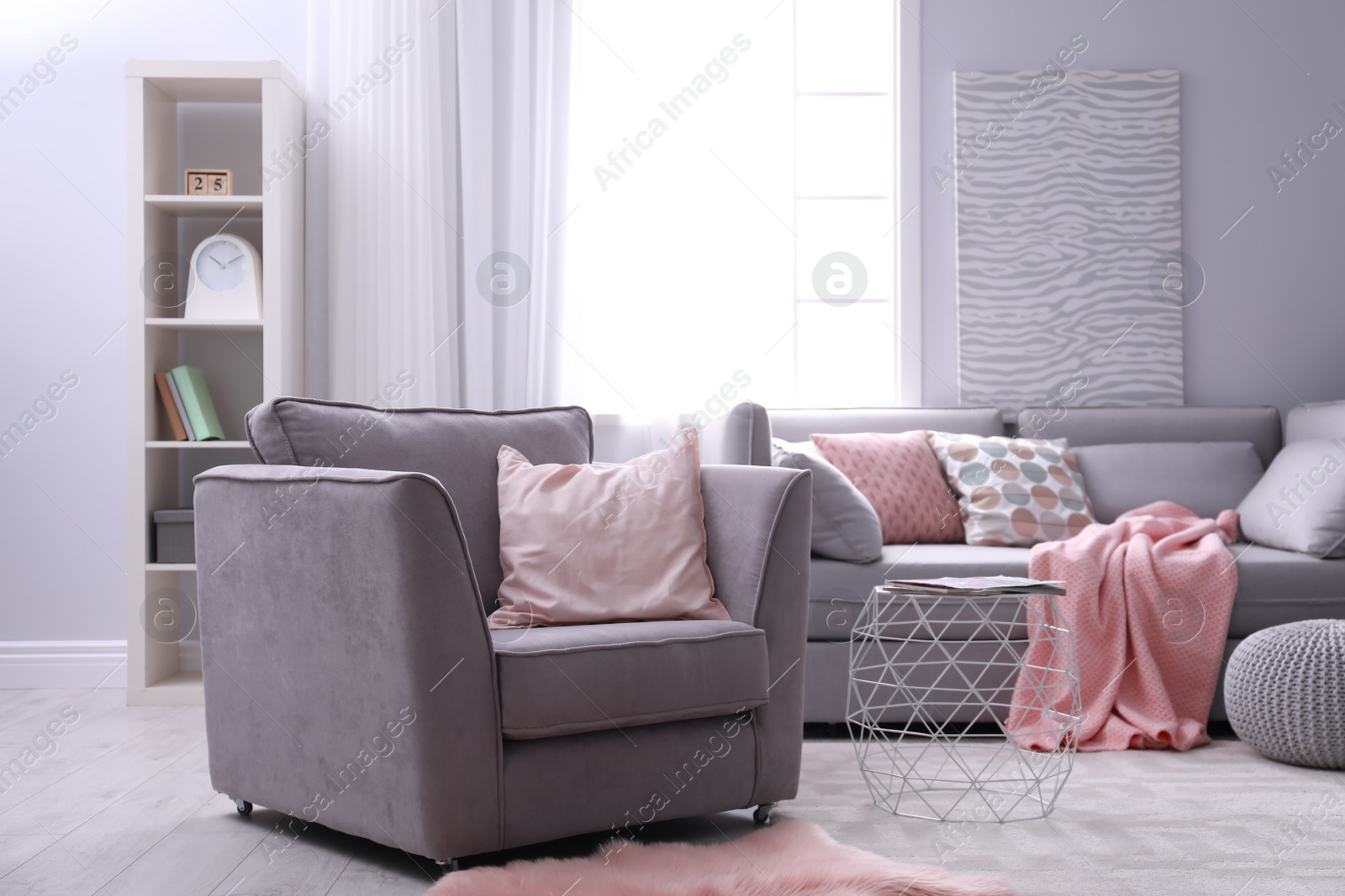 Photo of Light apartment with comfortable armchair. Stylish interior