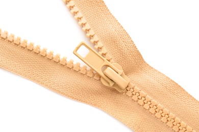 Photo of Beige zipper on white background, top view