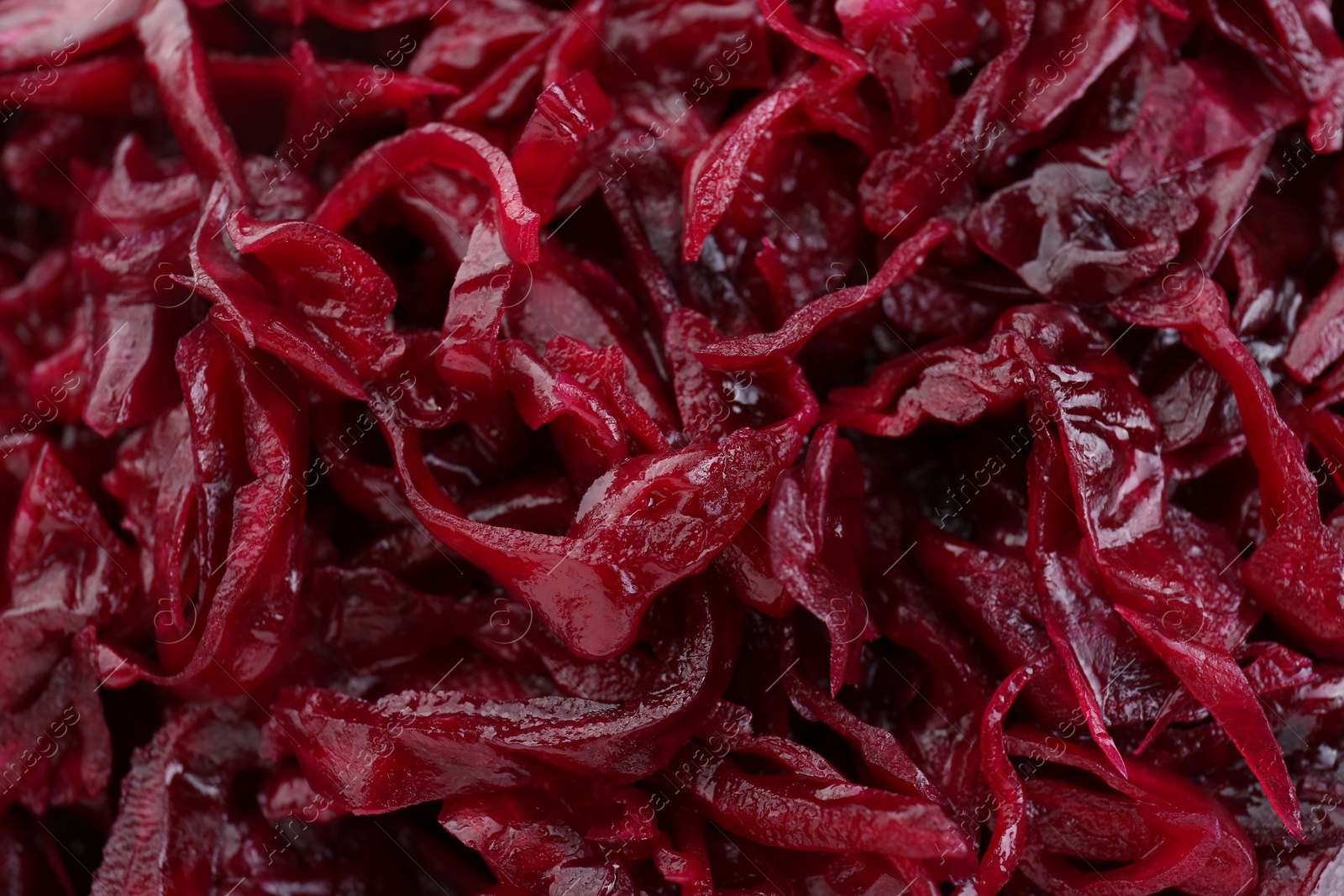 Photo of Tasty red cabbage sauerkraut as background, closeup