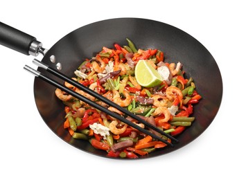 Photo of Shrimp stir fry with vegetables in wok and chopsticks isolated on white
