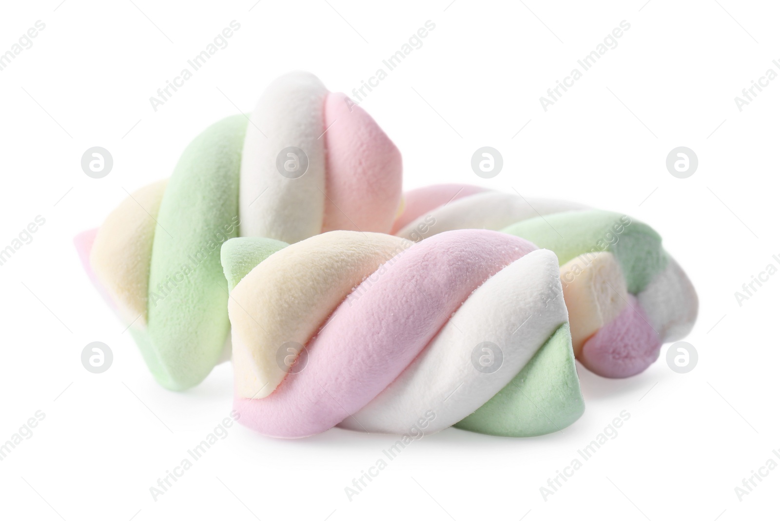 Photo of Three delicious colorful marshmallows isolated on white