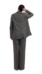 Businesswoman in suit on white background, back view