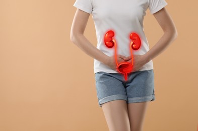 Woman suffering from cystitis on beige background, closeup. Illustration of urinary system