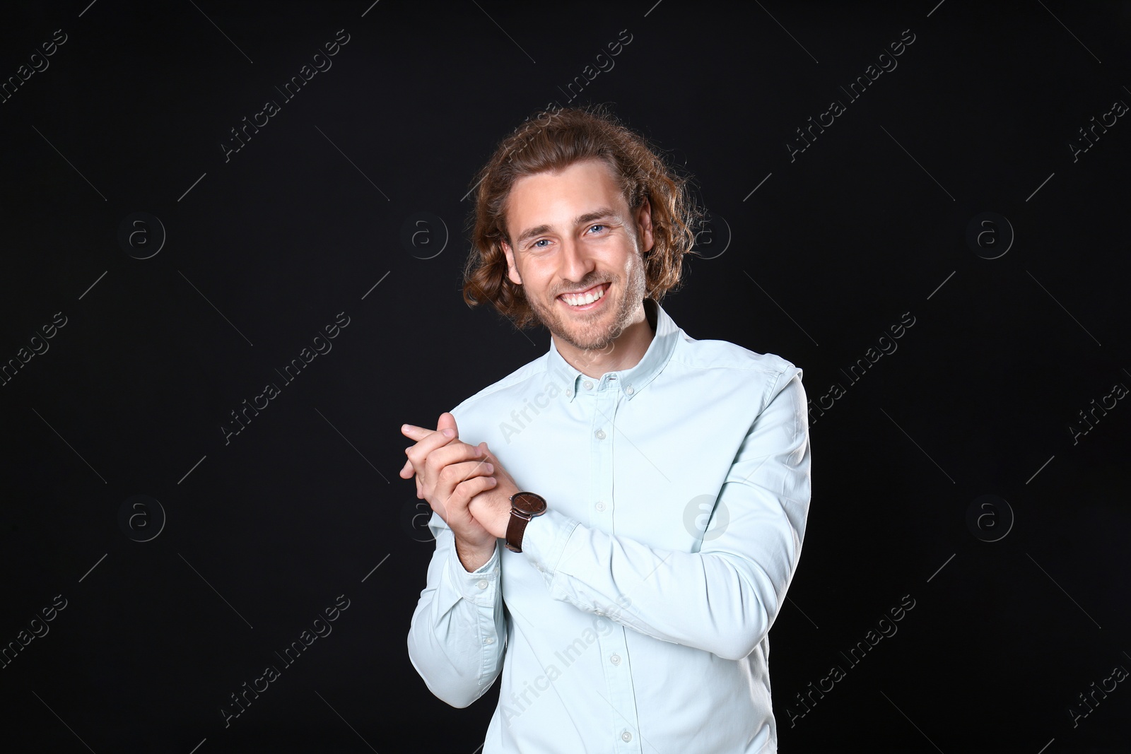 Photo of Portrait of handsome man on black background