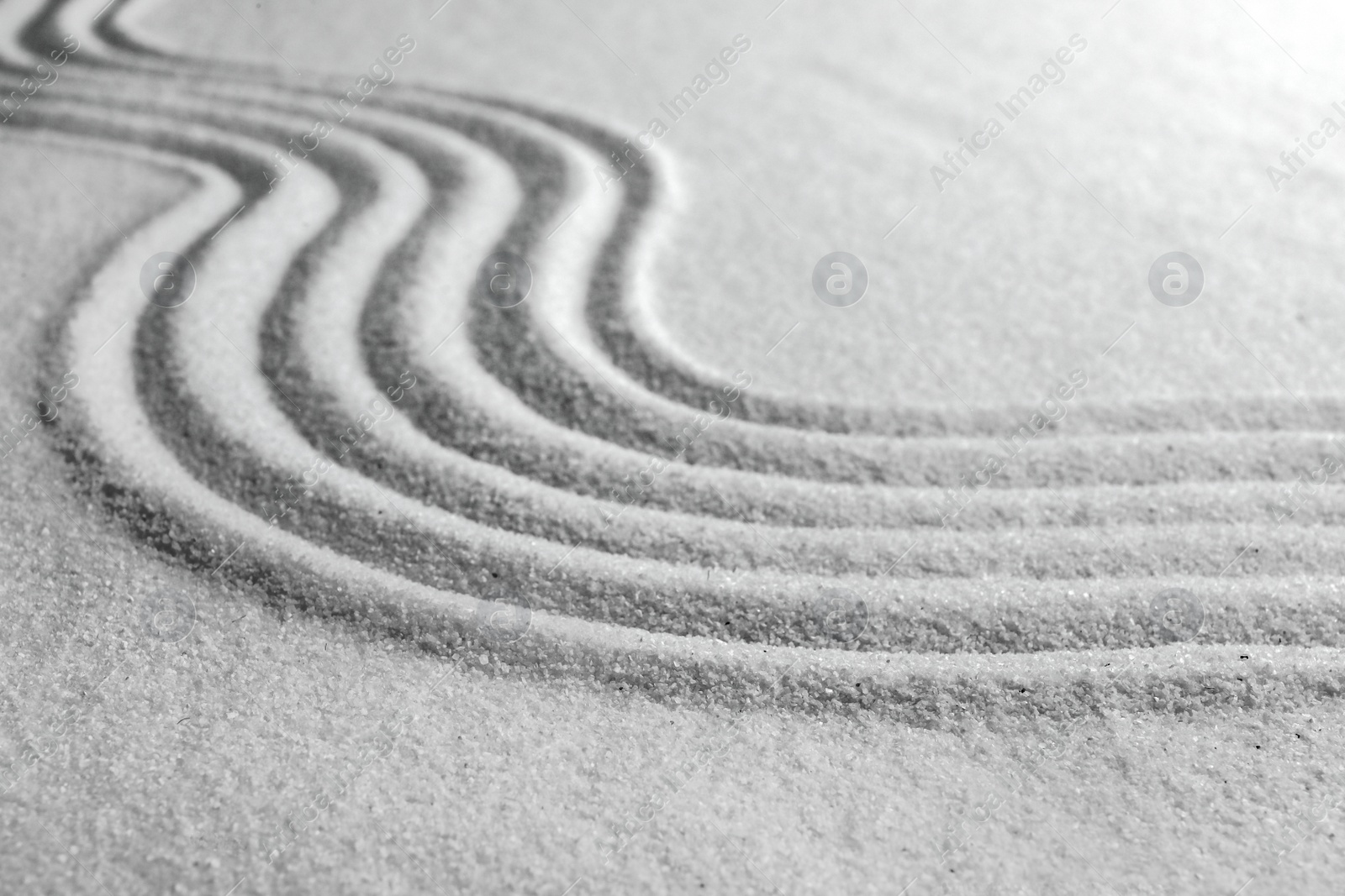 Photo of White sand with pattern as background. Zen, meditation, harmony