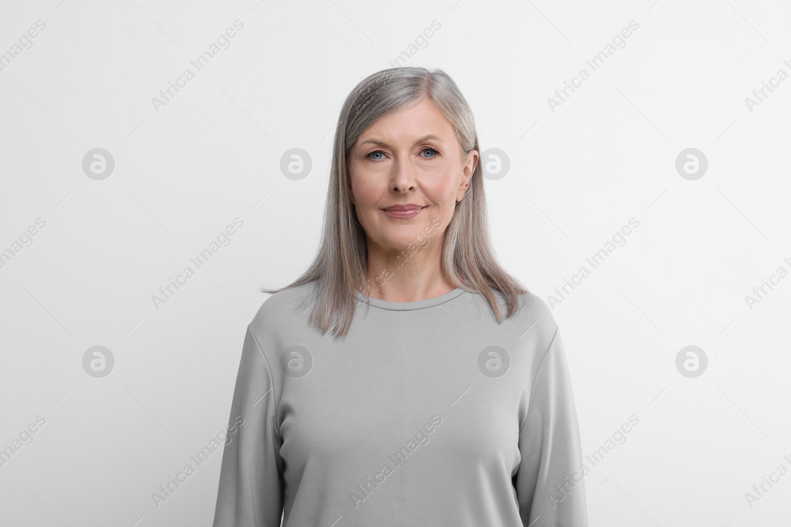 Photo of Portrait of beautiful senior woman on white background