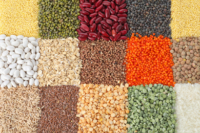 Different grains and cereals as background, top view