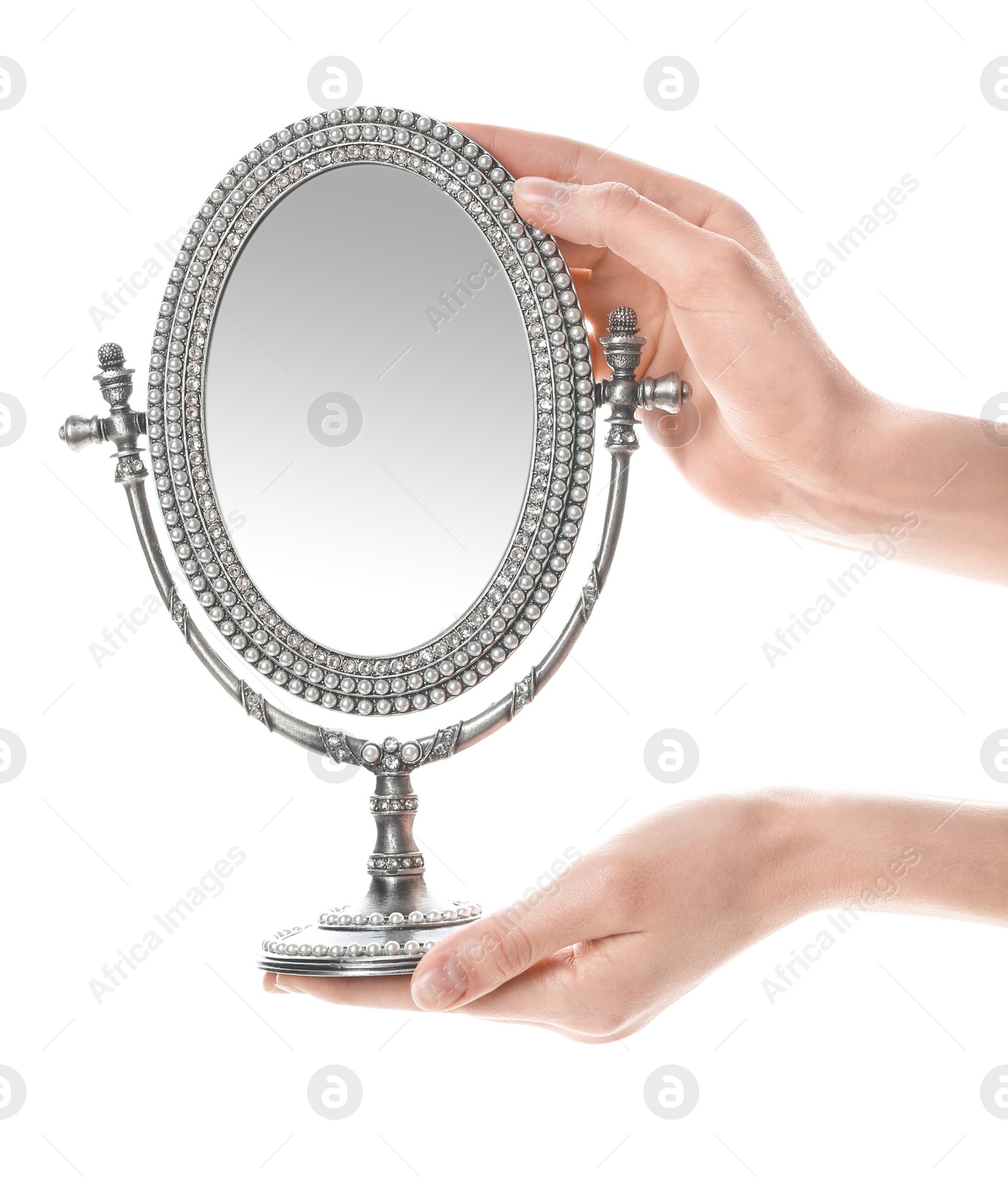 Photo of Woman holding vintage mirror against white background