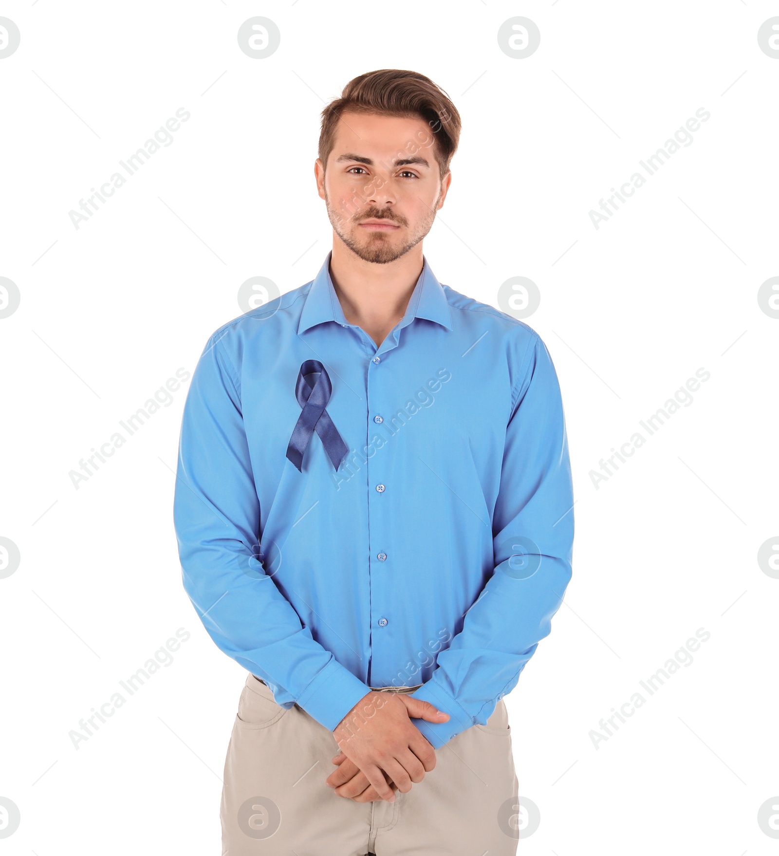 Photo of Young man with blue ribbon on white background. Urological cancer awareness