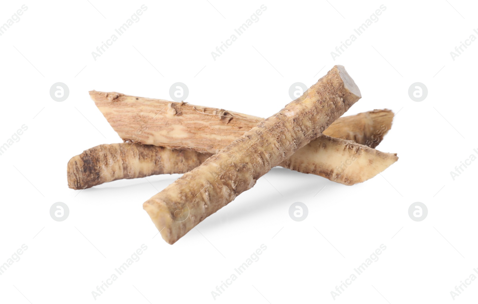 Photo of Fresh cut horseradish roots isolated on white