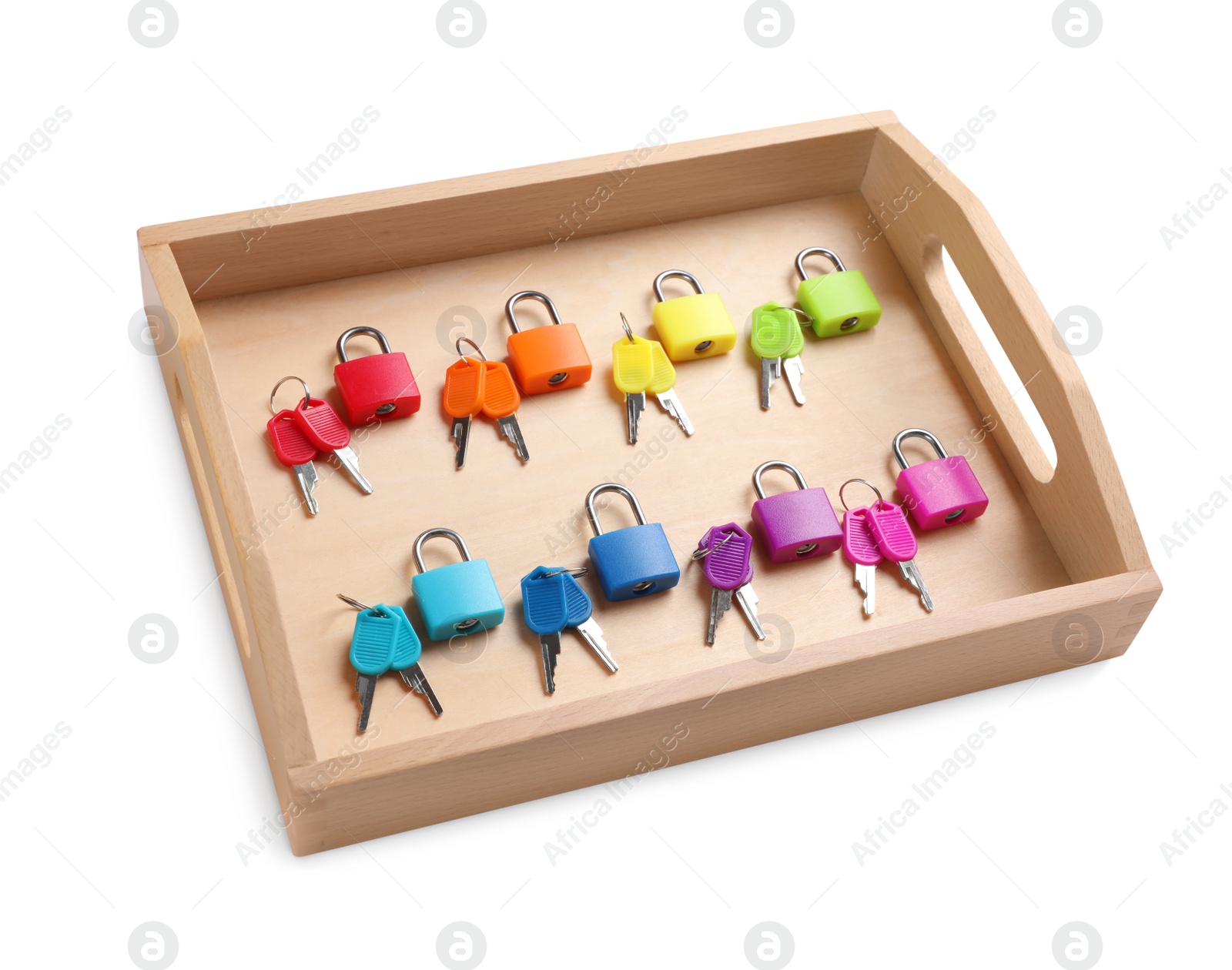 Photo of Set of colorful locks and matching keys in box isolated on white. Montessori toy