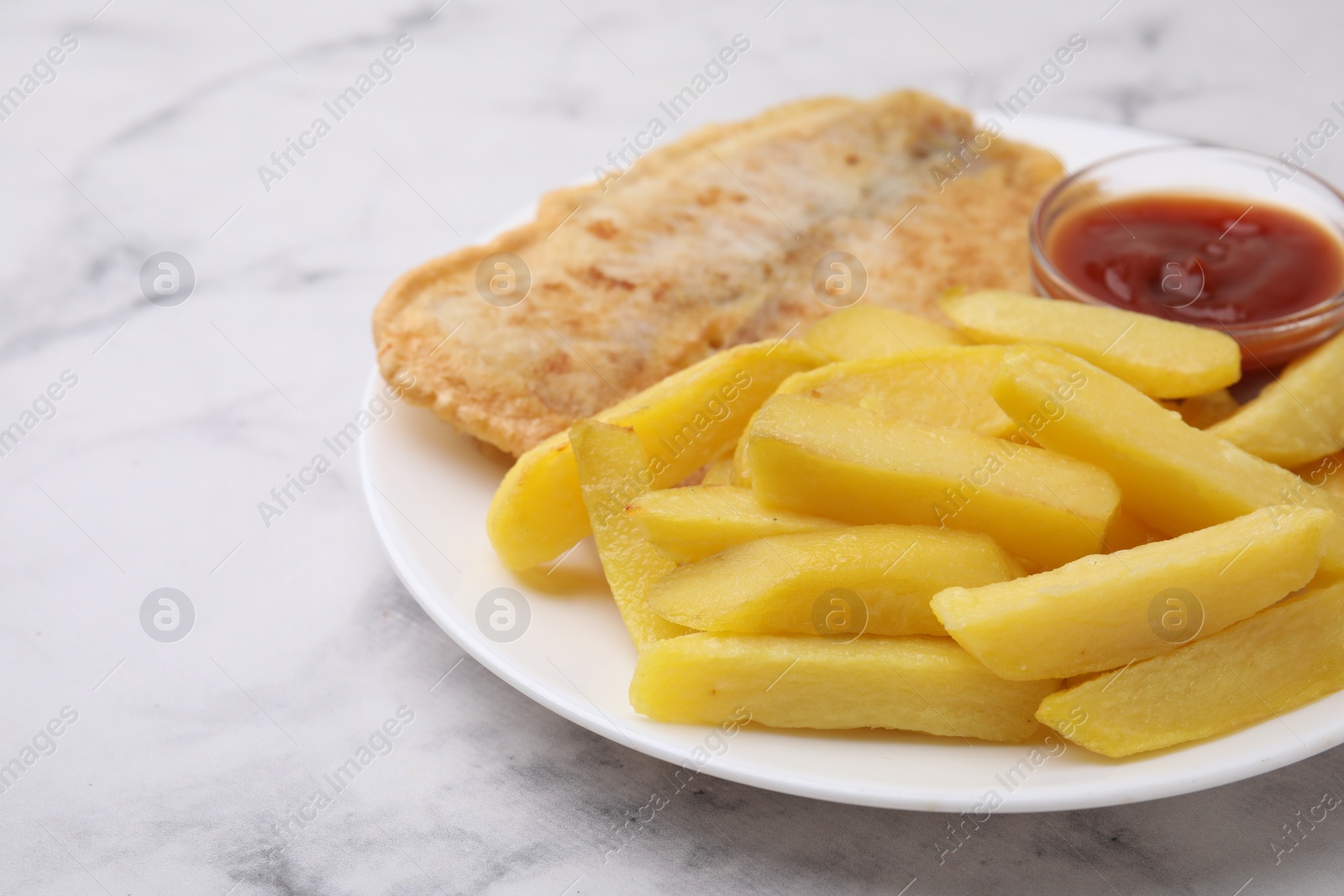 Photo of Delicious fish and chips with ketchup on light marble table, closeup