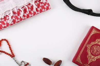 Flat lay composition with Muslim prayer beads, Quran and space for text on white background