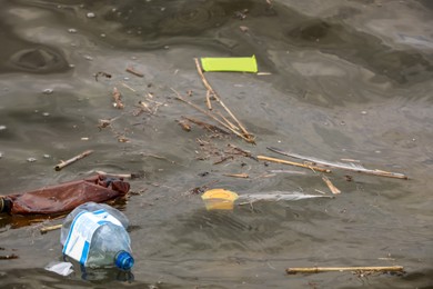 Photo of Plastic garbage floating in river. Environment pollution problem