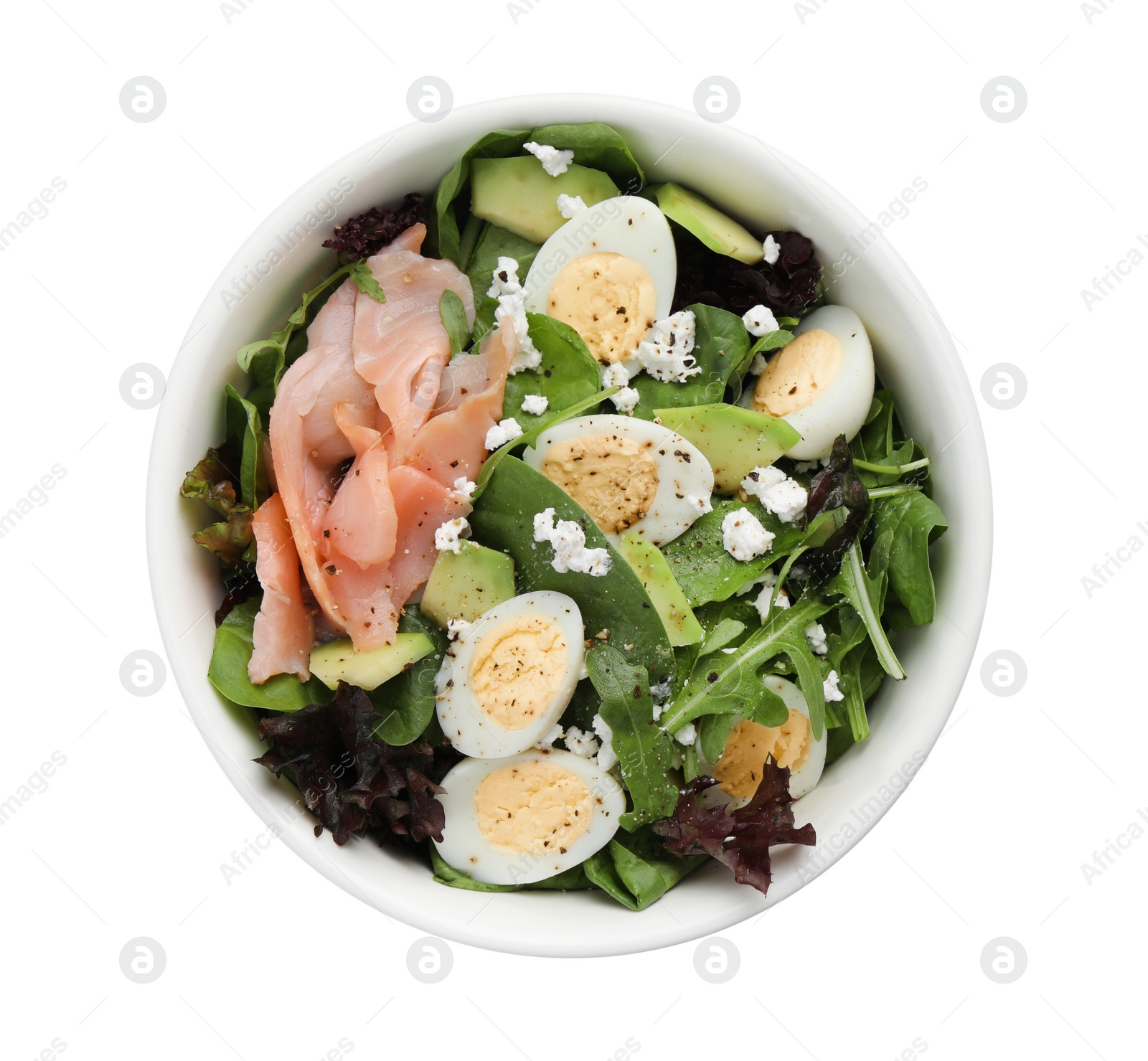 Photo of Delicious salad with boiled eggs, salmon and cheese in bowl isolated on white, top view