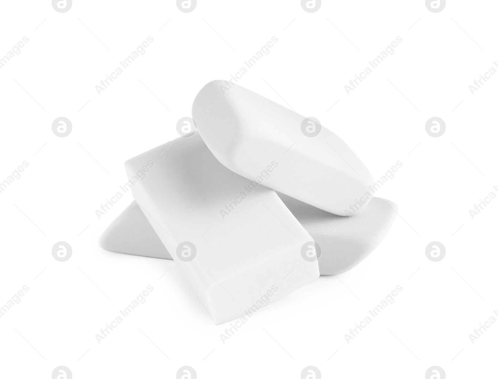 Photo of New erasers isolated on white. School stationery