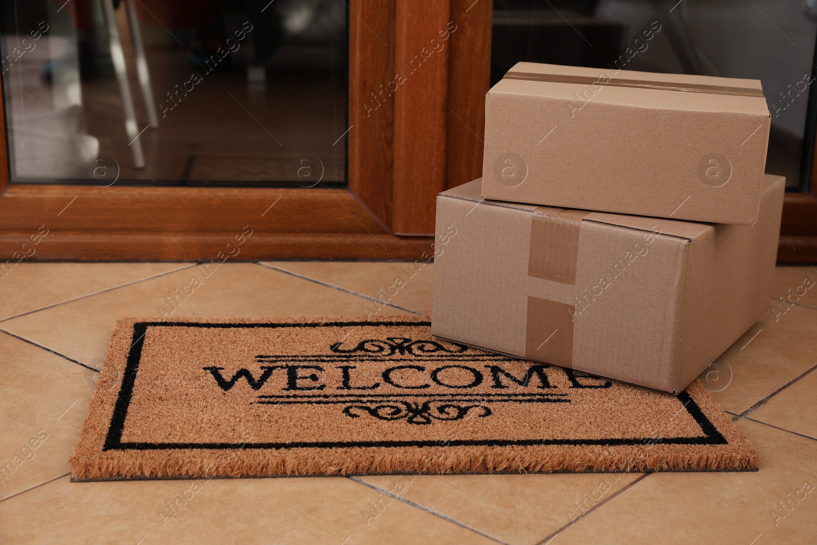 Photo of Parcels delivered on mat near front door